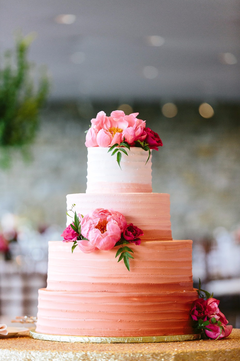 Pink ombre wedding cake with flowers