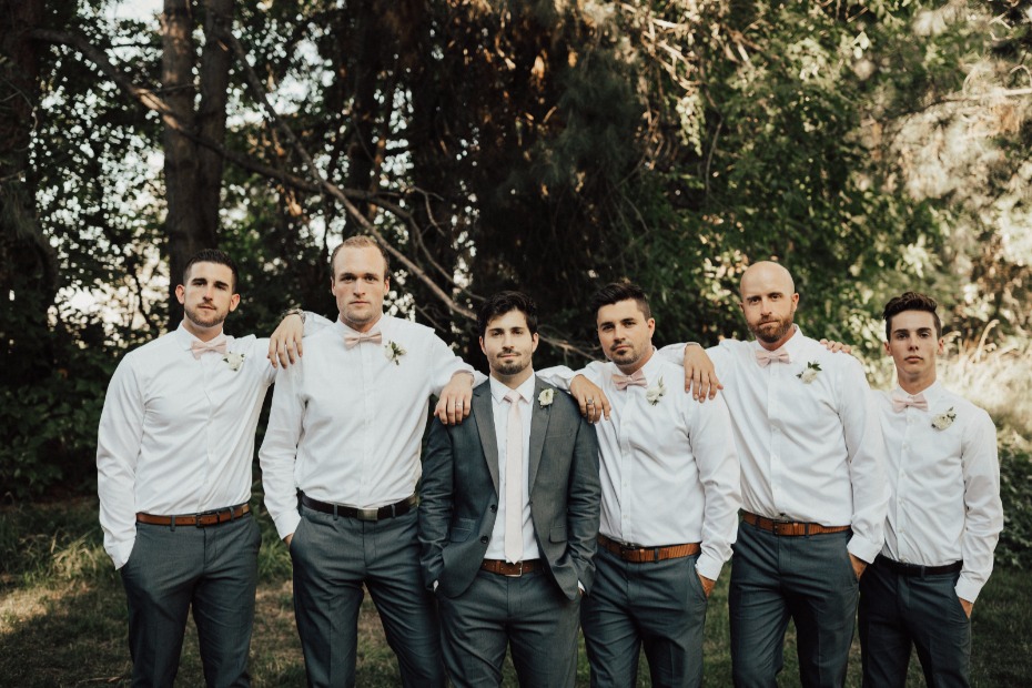 gray groom suits with pink bow ties