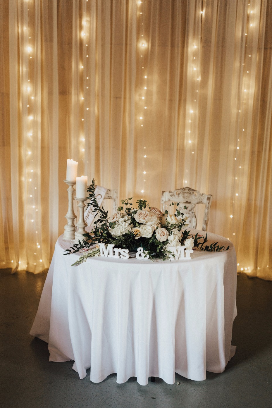 sweetheart wedding table with twinkly light drop