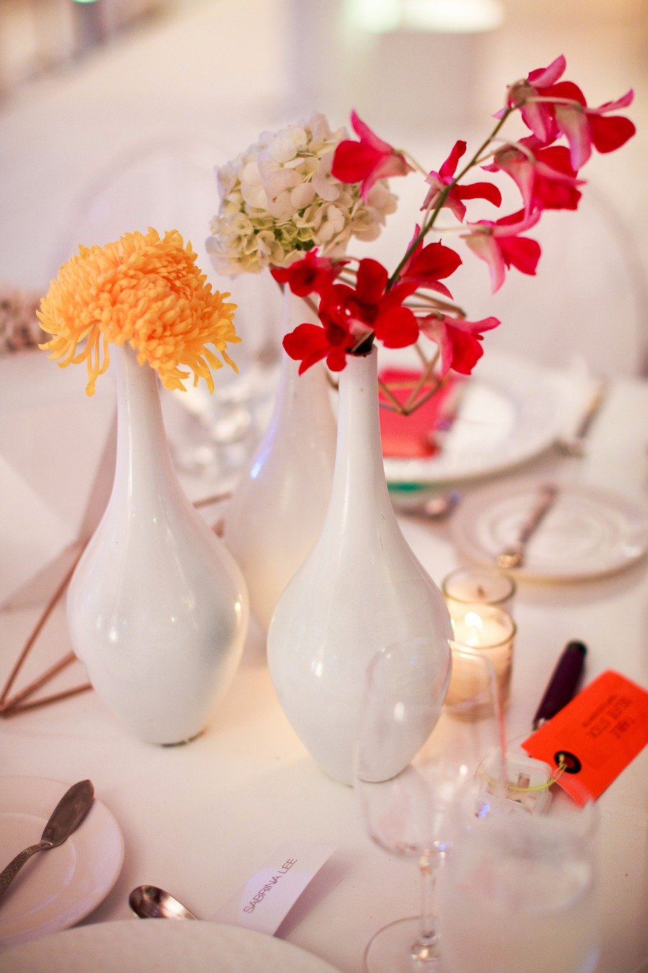 Simple white vases with buds