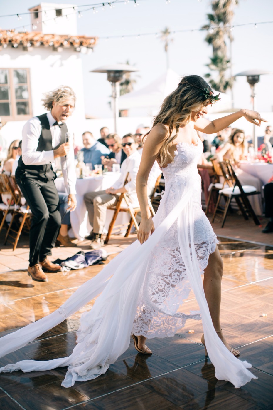 Bride dances joyfully at her outdoor wedding reception
