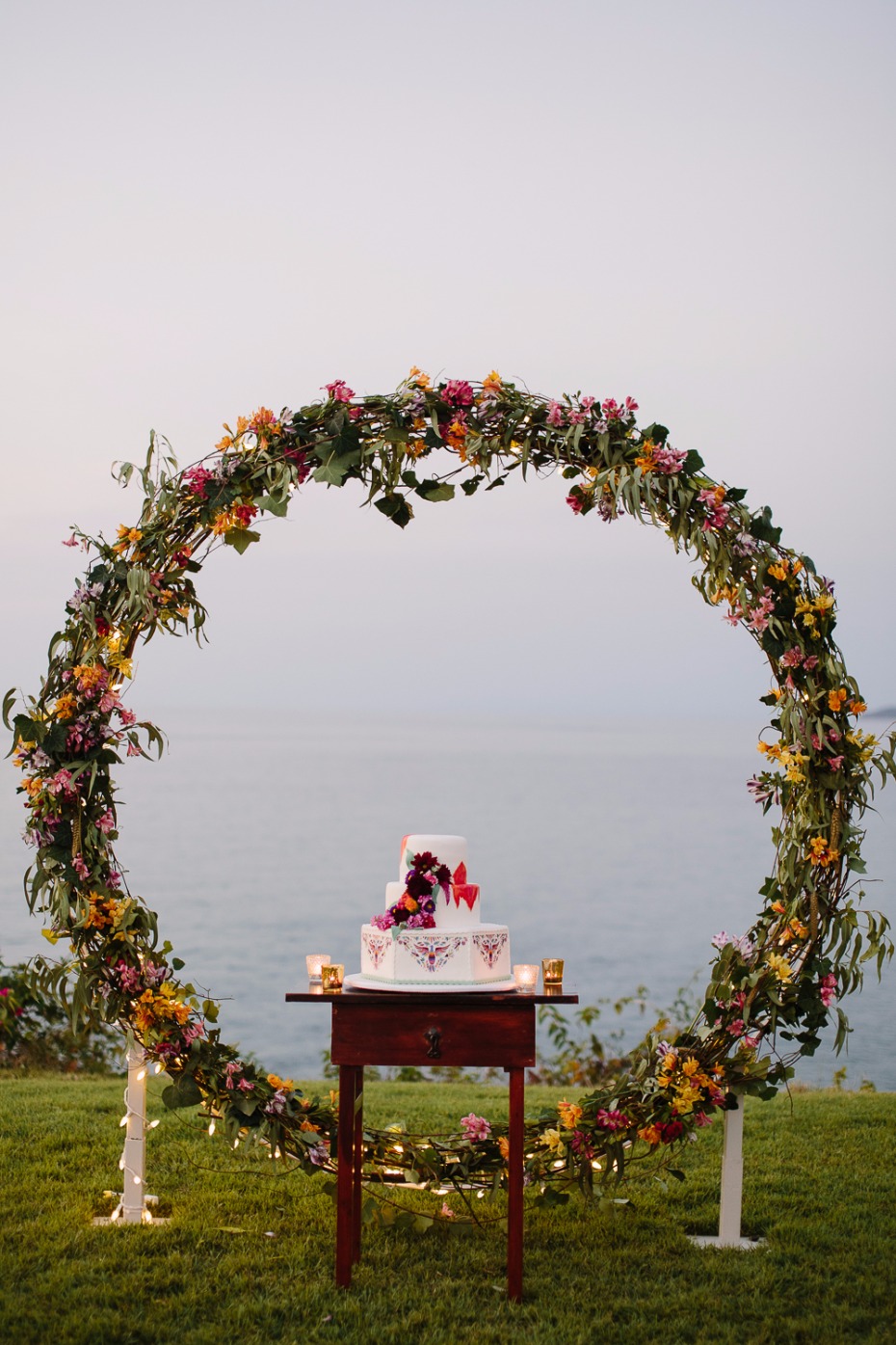 Use your ceremony arch as the cake backdrop