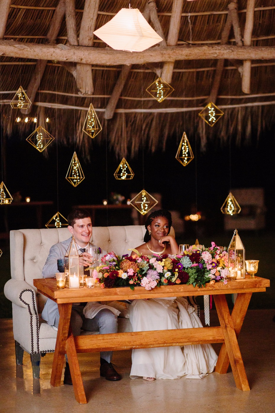 Love the hanging lights behind the sweetheart table