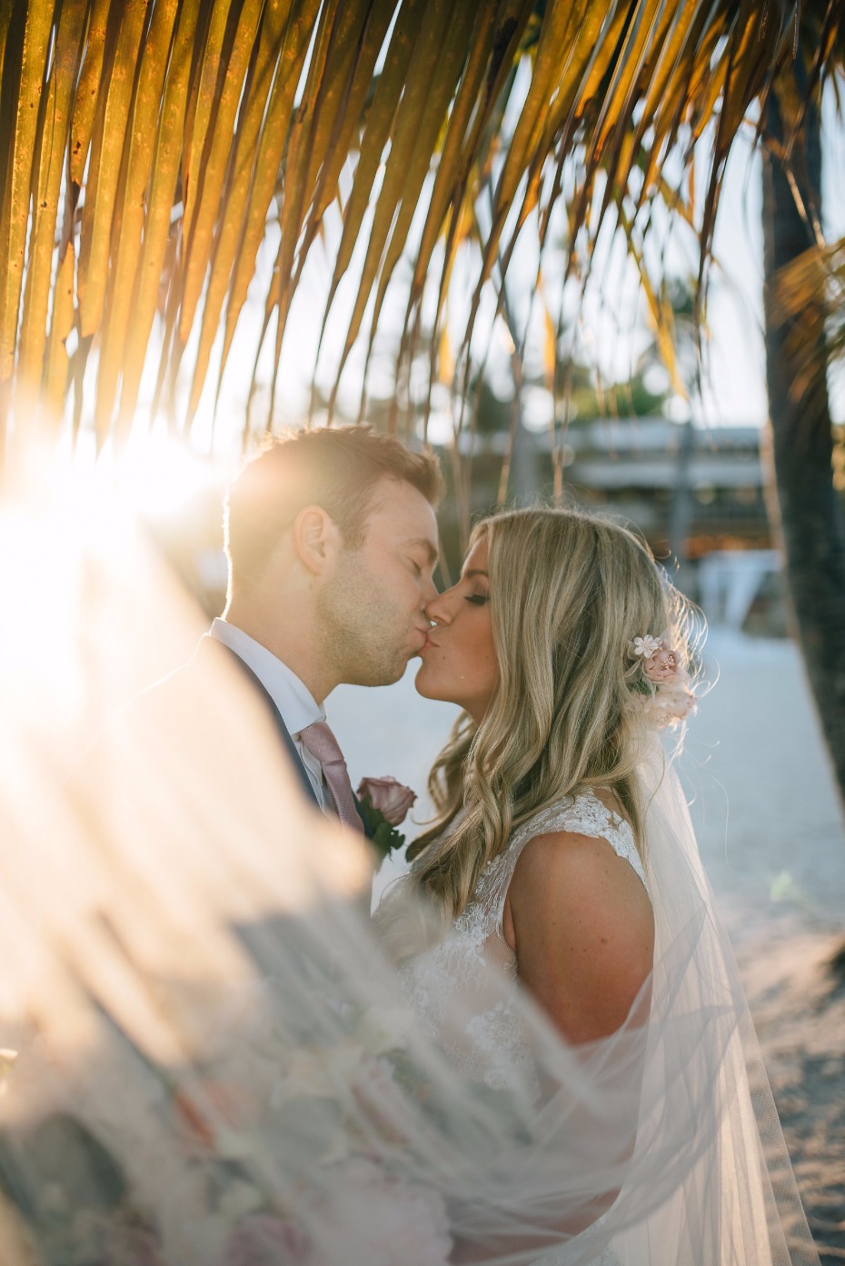 sunset wedding kiss on the beach in Mexico