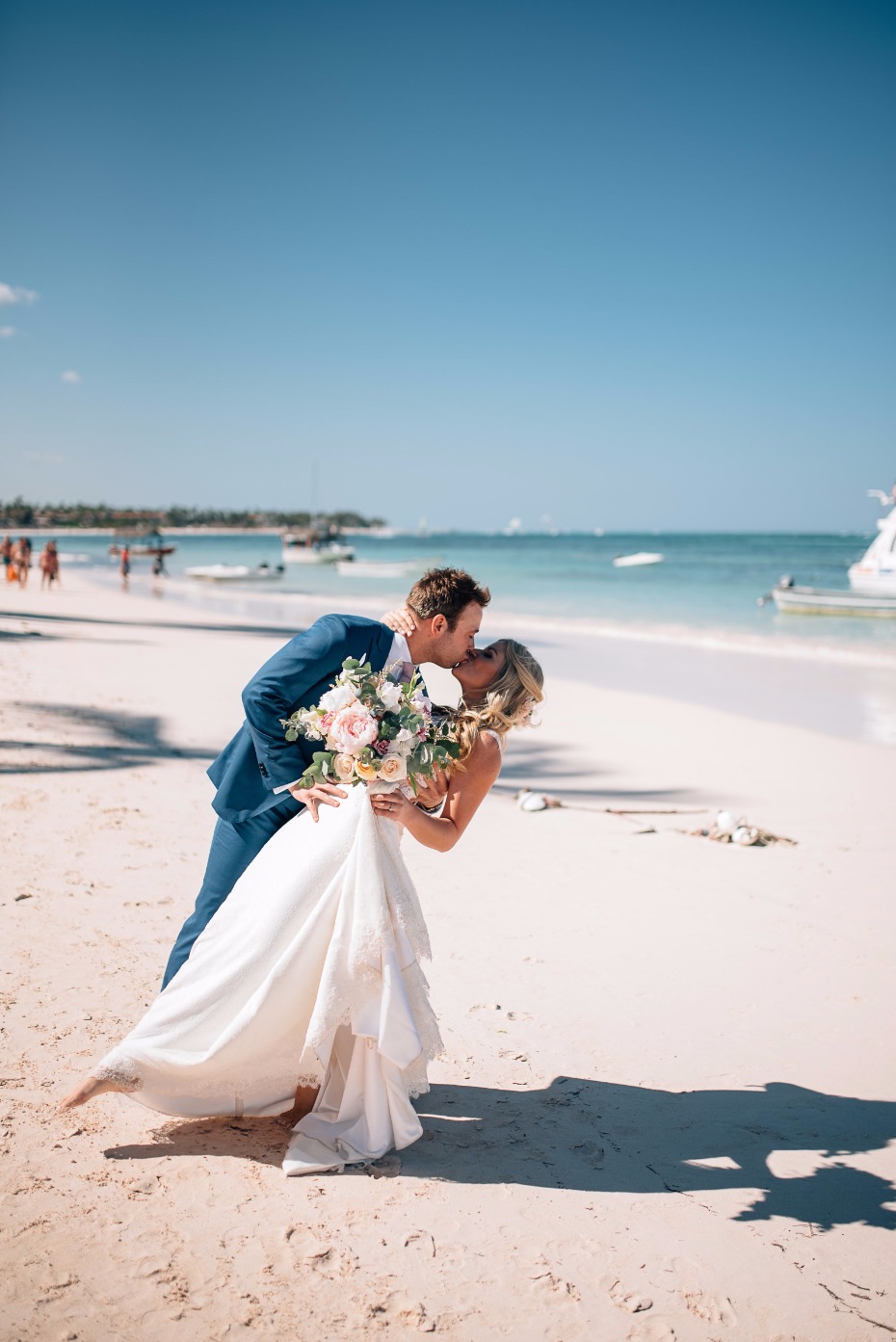beach dip and kiss wedding photo pose