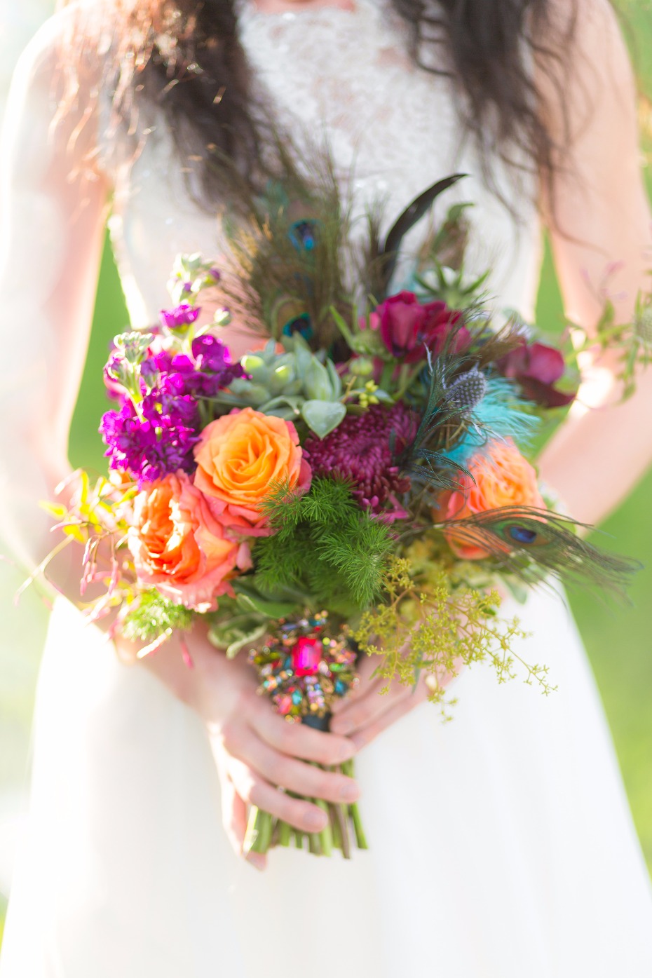 Jewel toned bouquet with peacock feathers