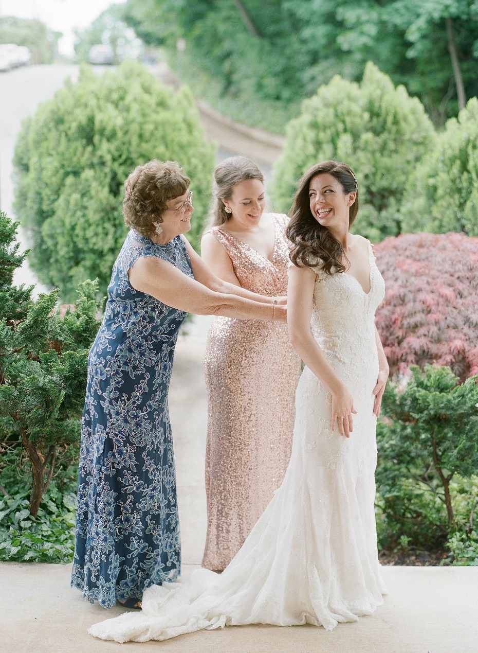 Bride with mother and sister before wedding