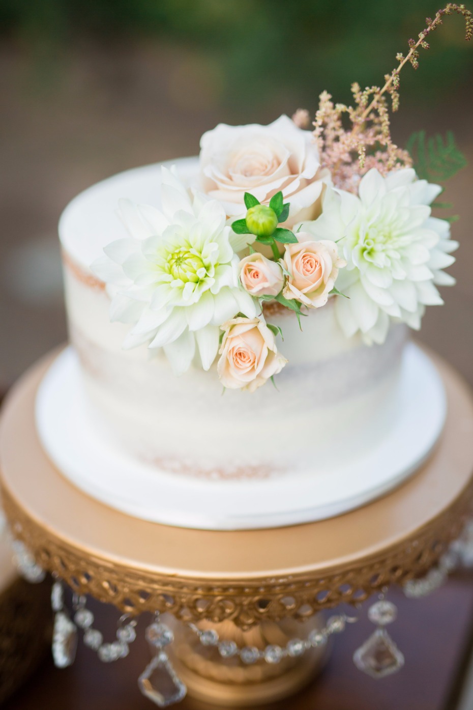 Naked cake with floral topper