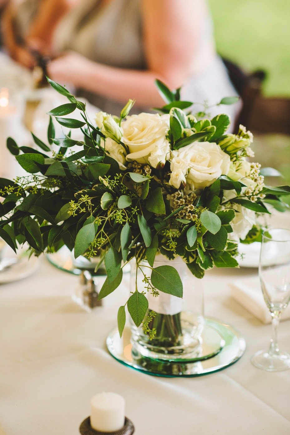 white rose and greenery centerpiece