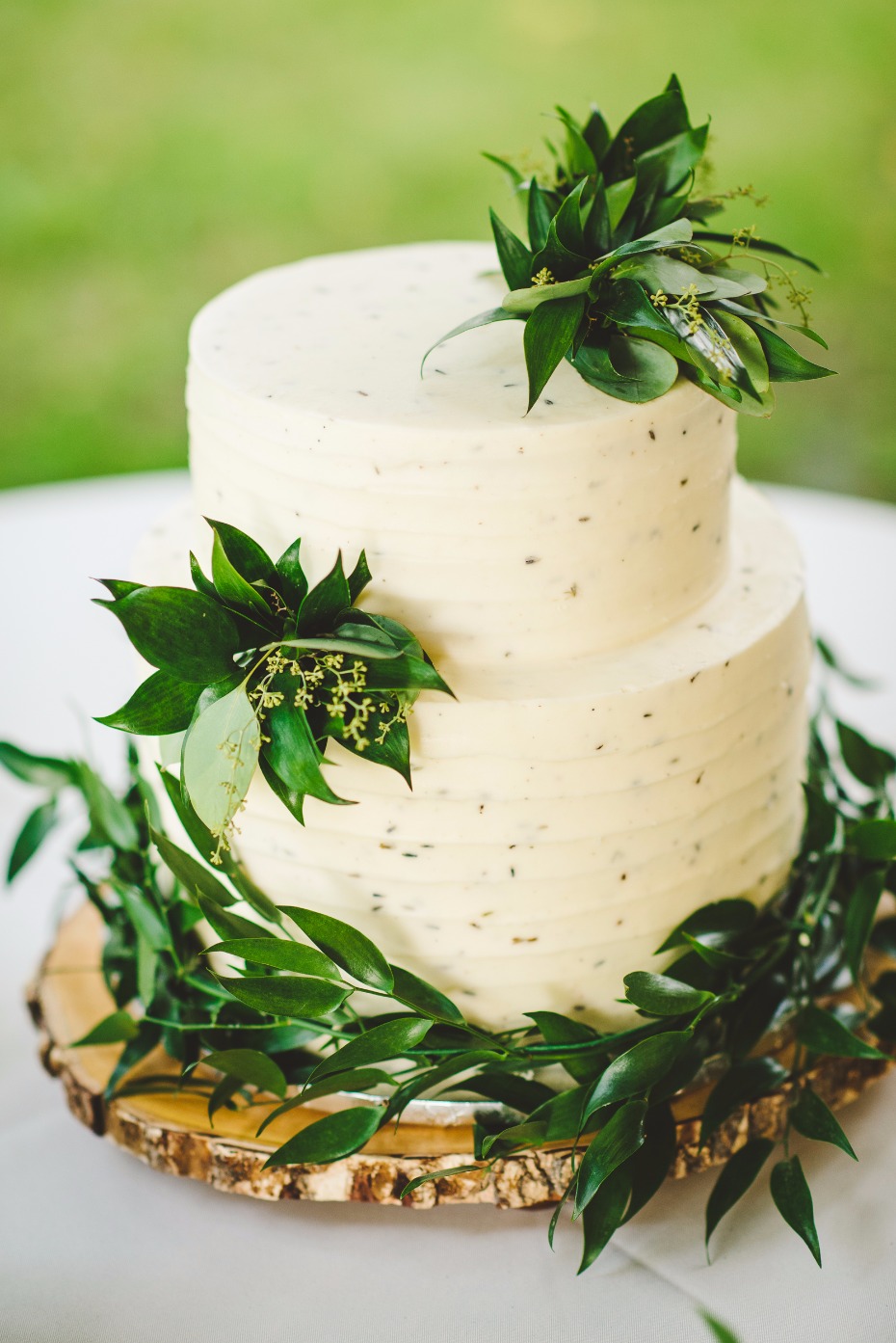 elegant wedding cake with simple greenery accents