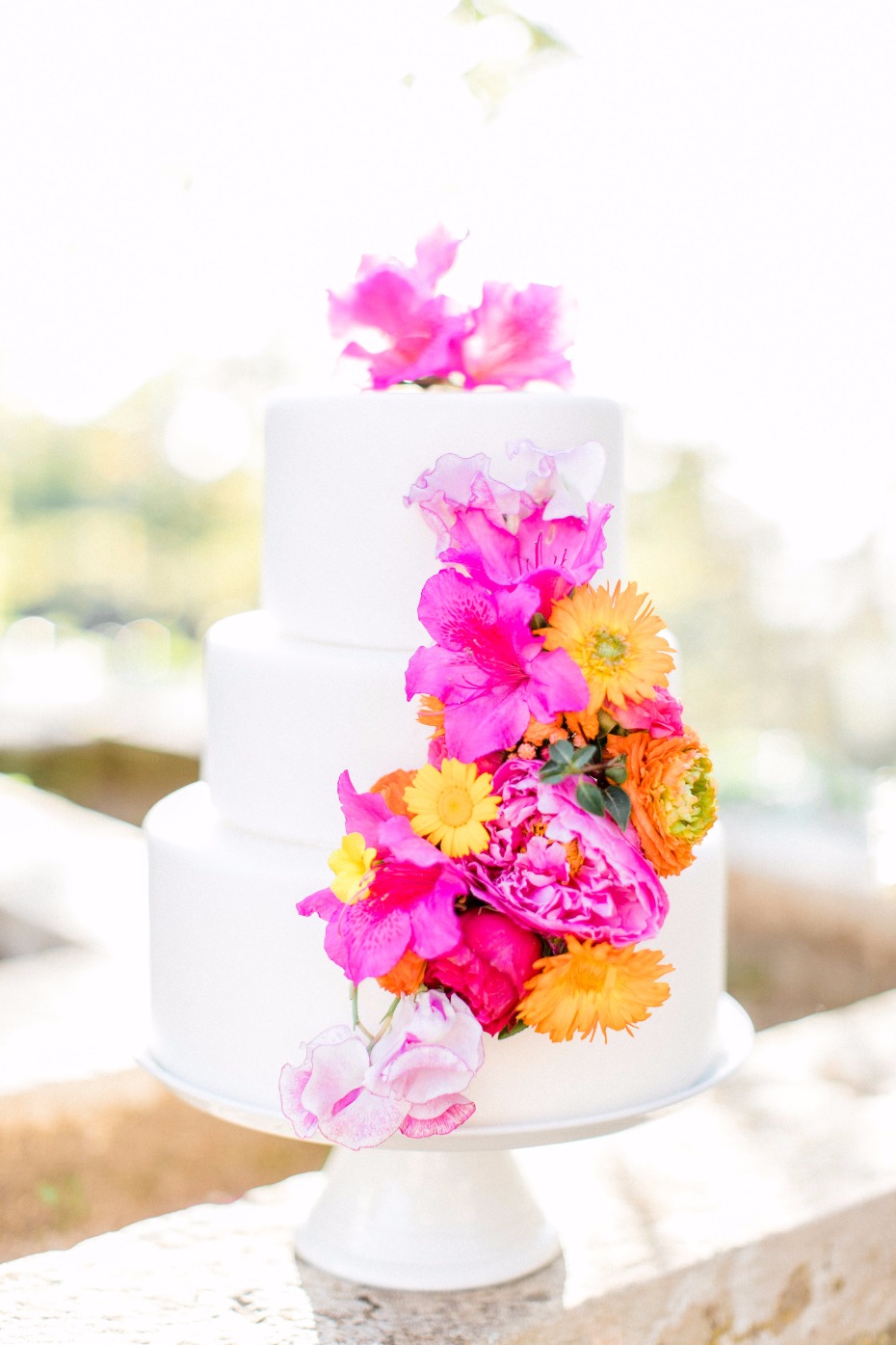 tropical floral accented wedding cake