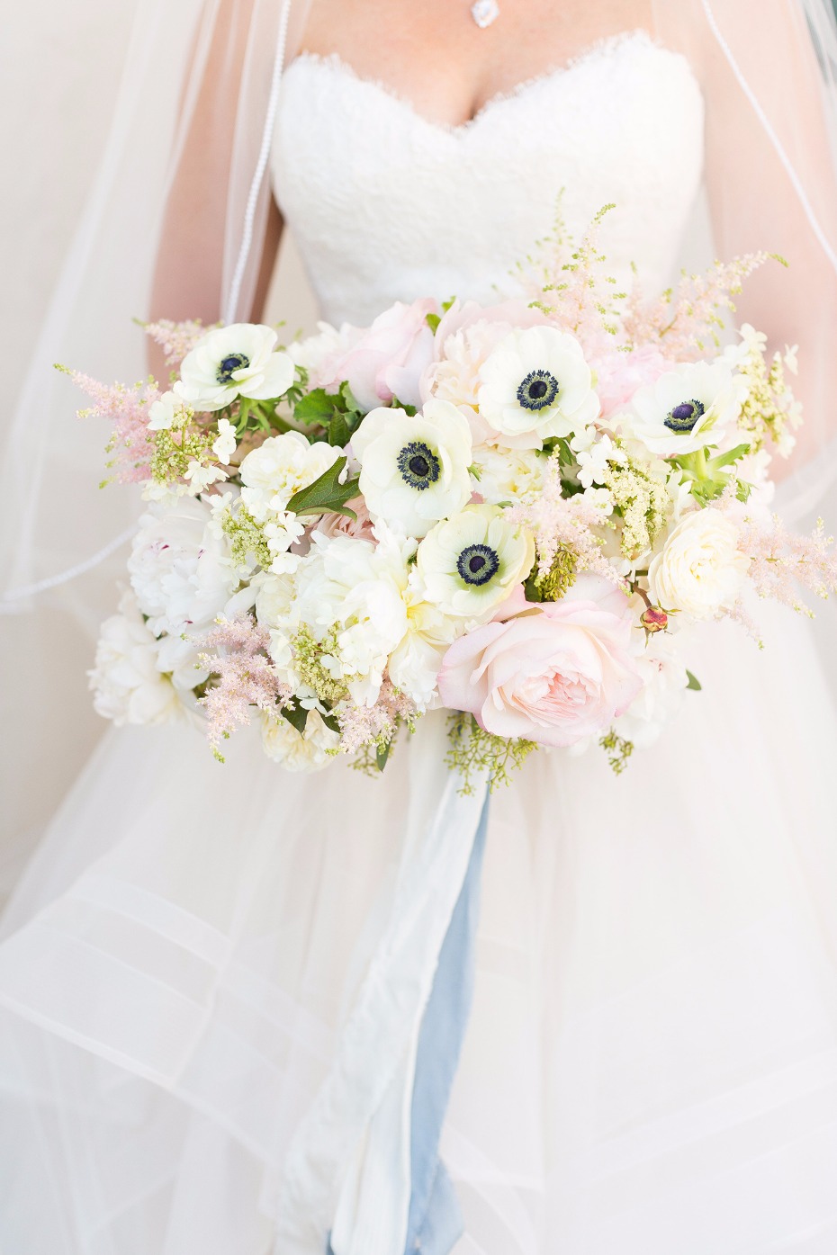 White and blush bouquet with blue ribbon