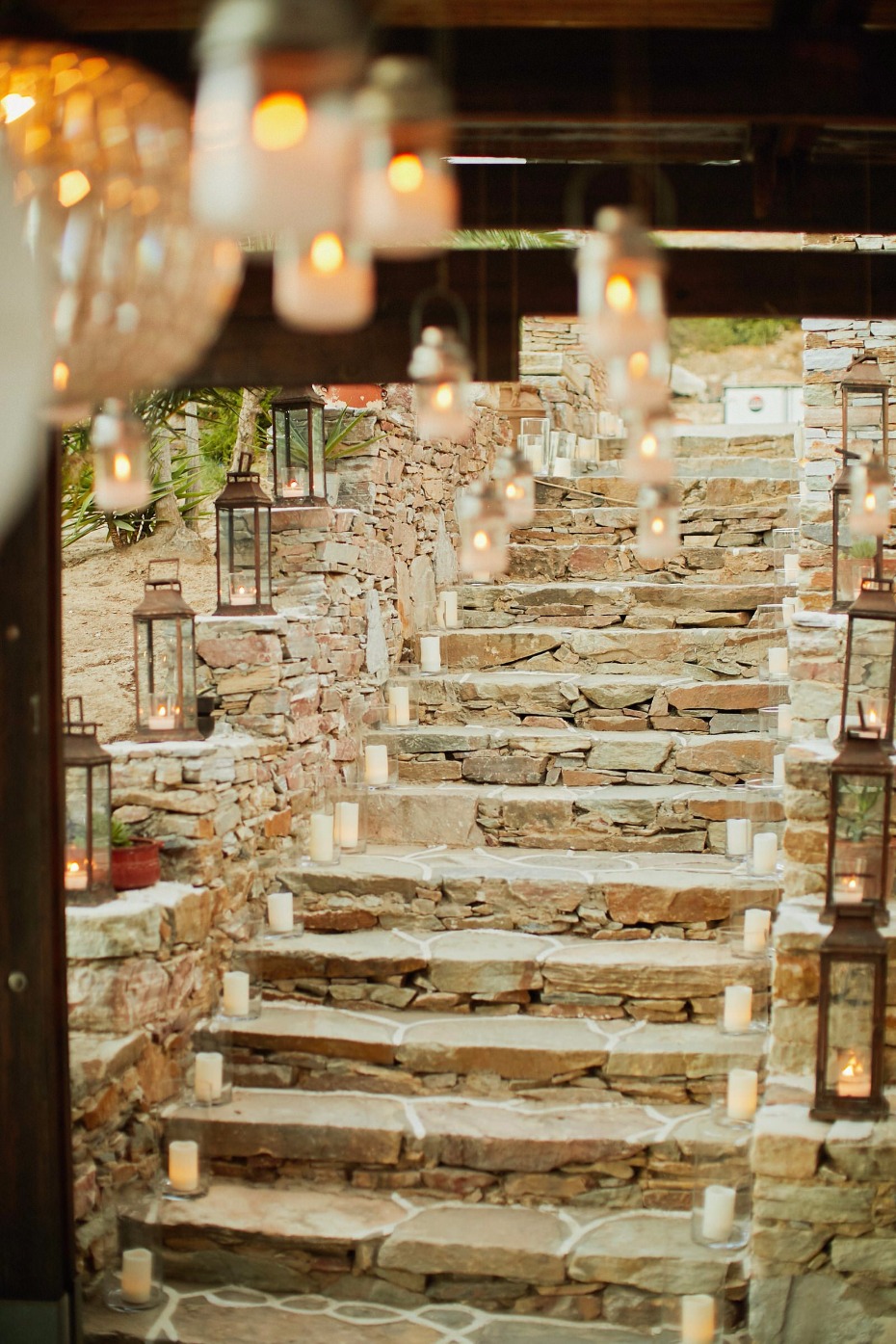 candle lit stairway entry into this Greek island wedding reception