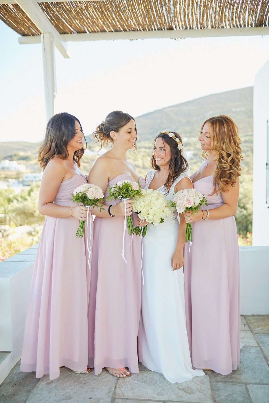blushing bridesmaids in soft blush dresses