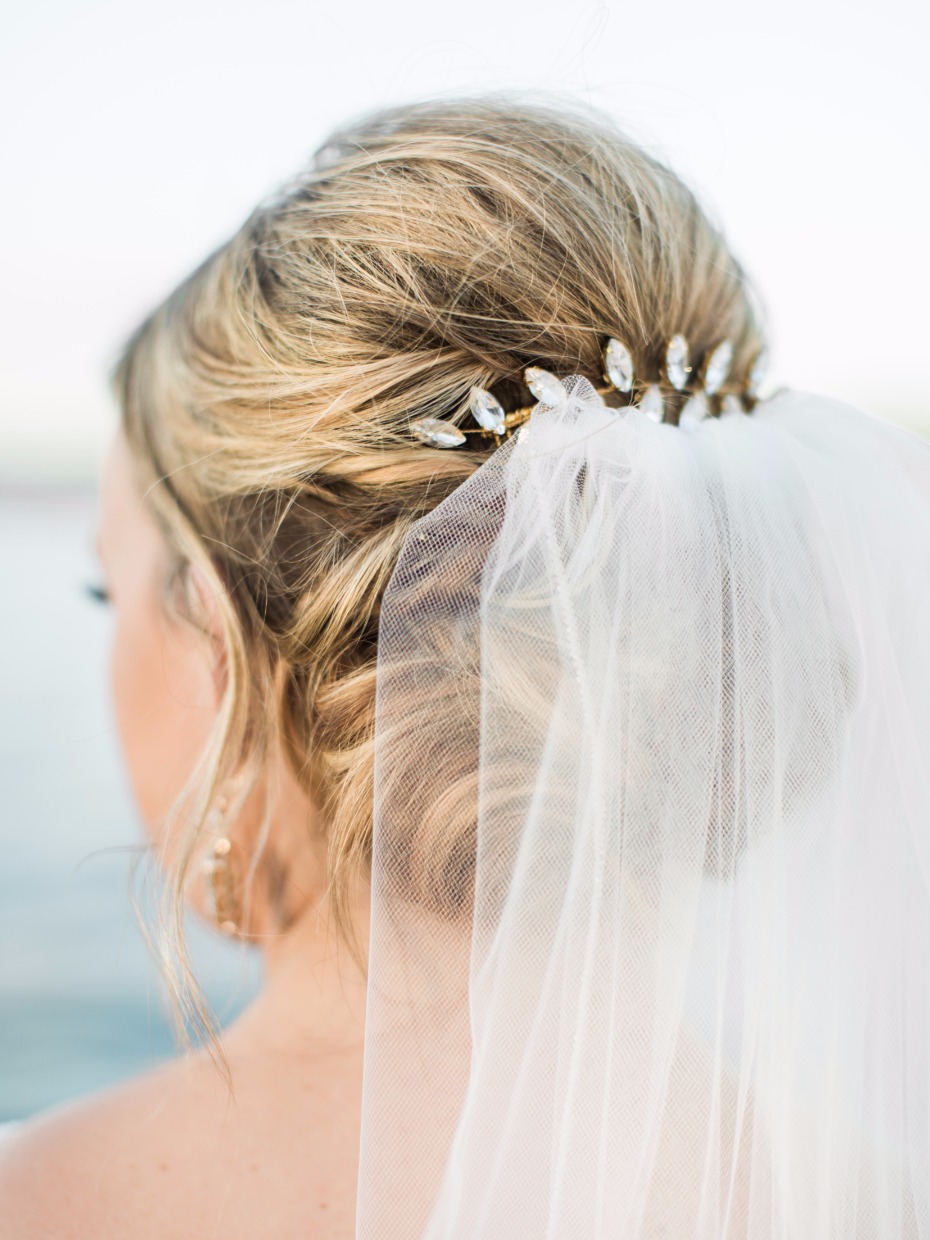 wedding updo with glam hair accessories