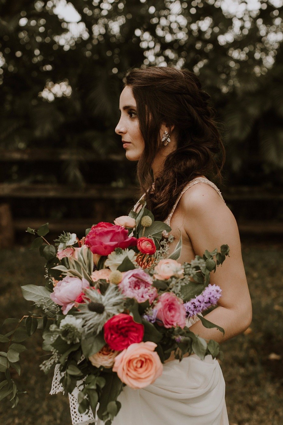 Braided bridal hair + colorful bouquet