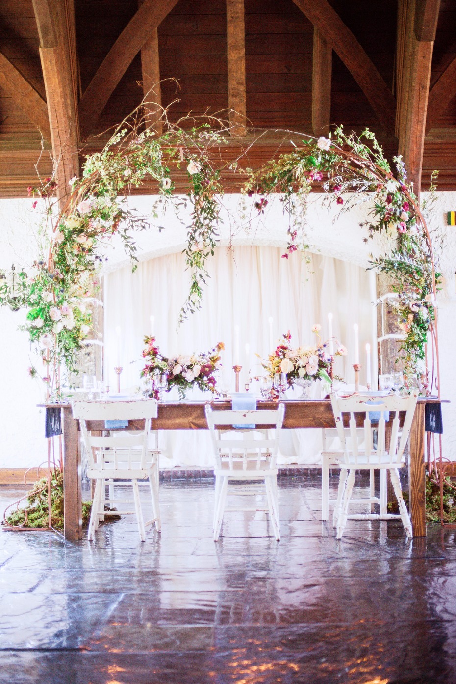 romantic weeping style floral arch for over your wedding table
