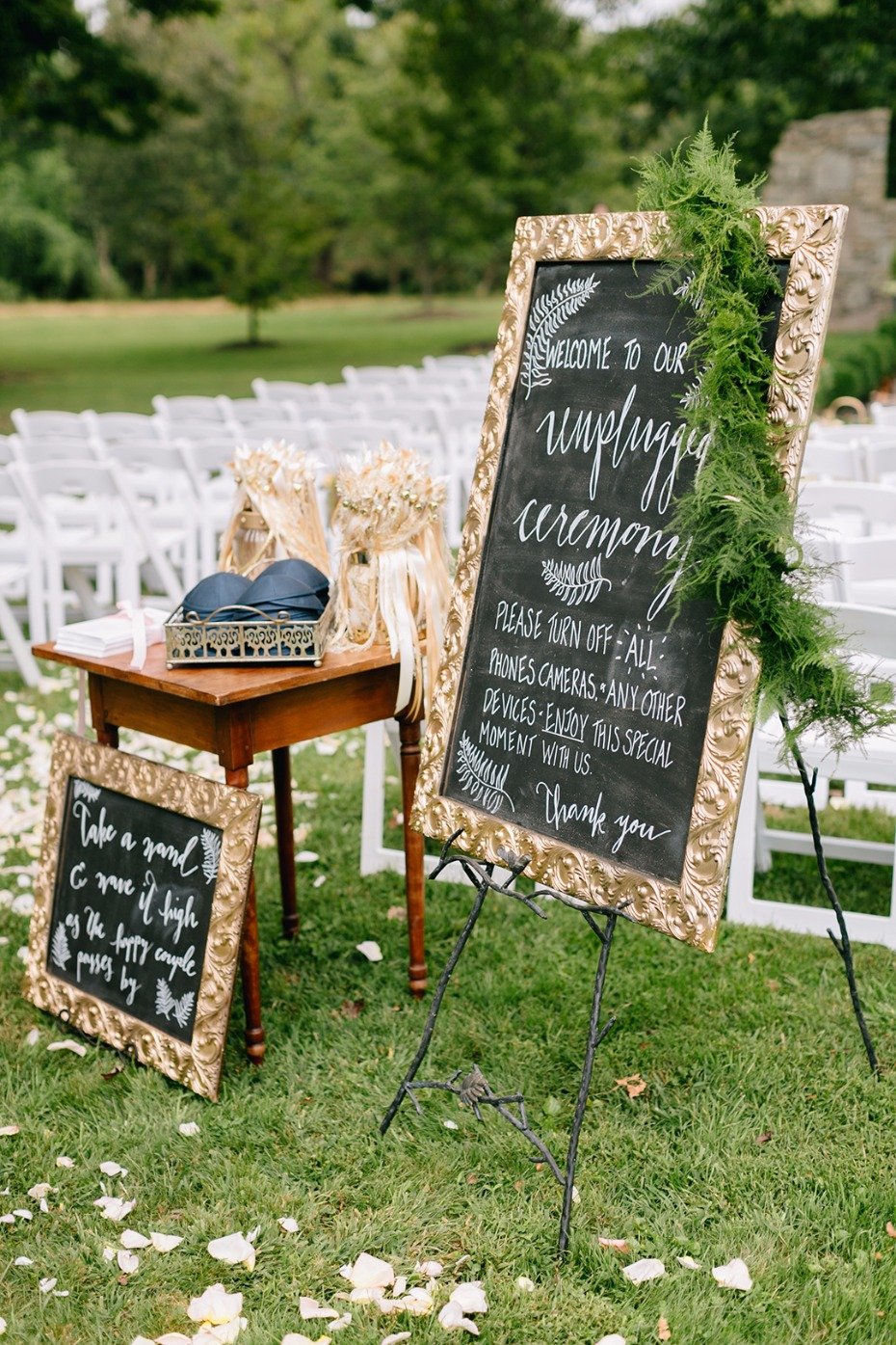 chalkboard sign announcing an unplugged wedding ceremony