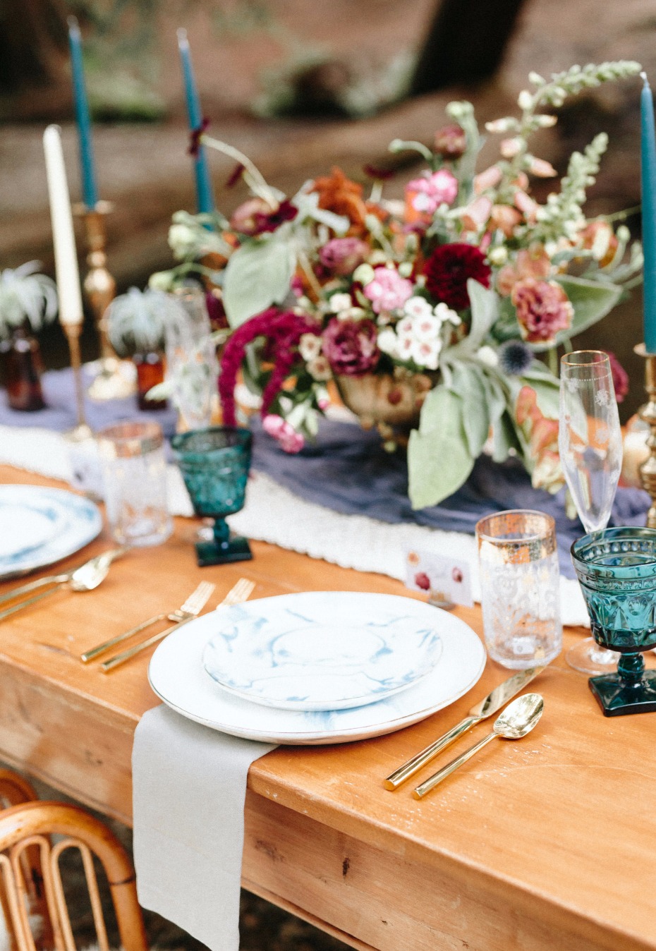 mismatched wedding table decor give the table a shabby chic quality