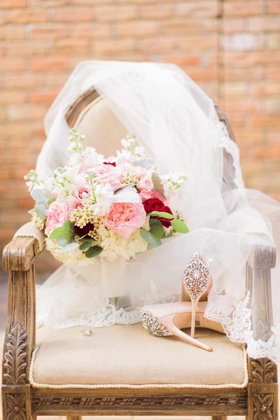 pink and white and red wedding bouquet with glittery wedding shoes