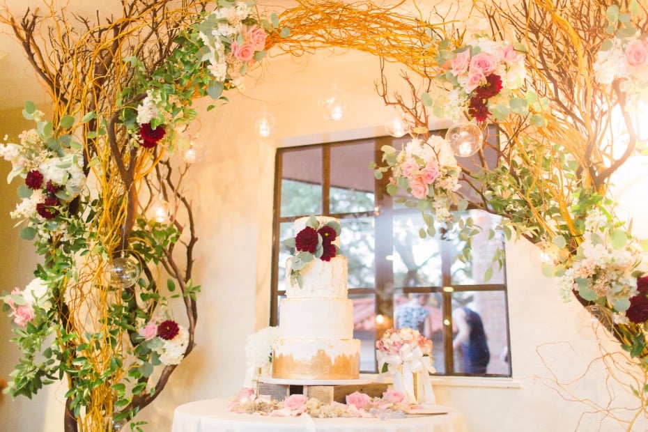 whimsical wedding cake table floral arch