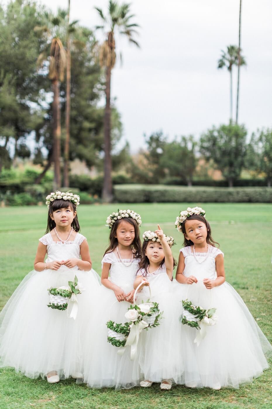 sweet little flower girls in white tutus