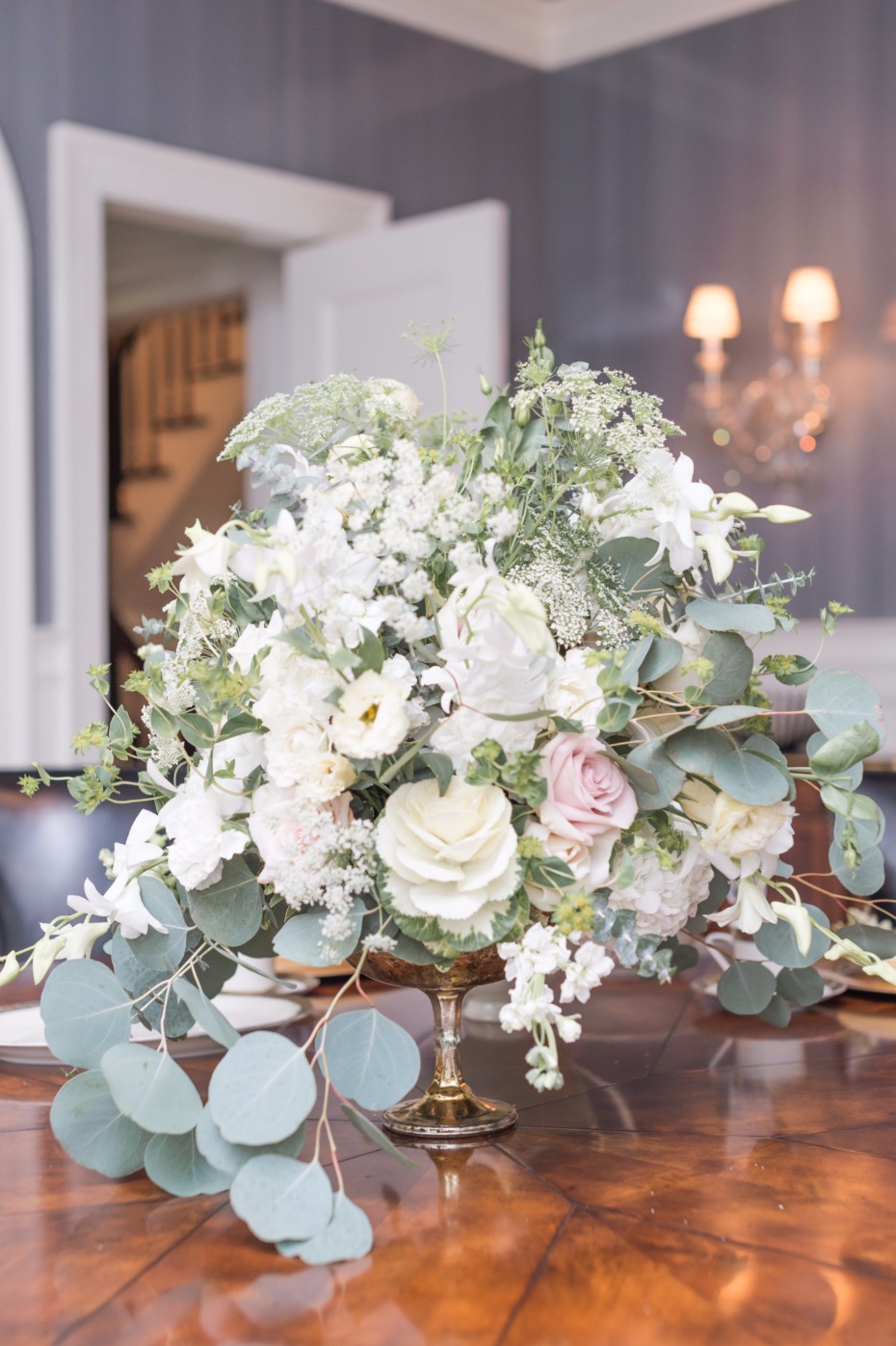 cascading wedding centerpiece in neutral florals and greenery