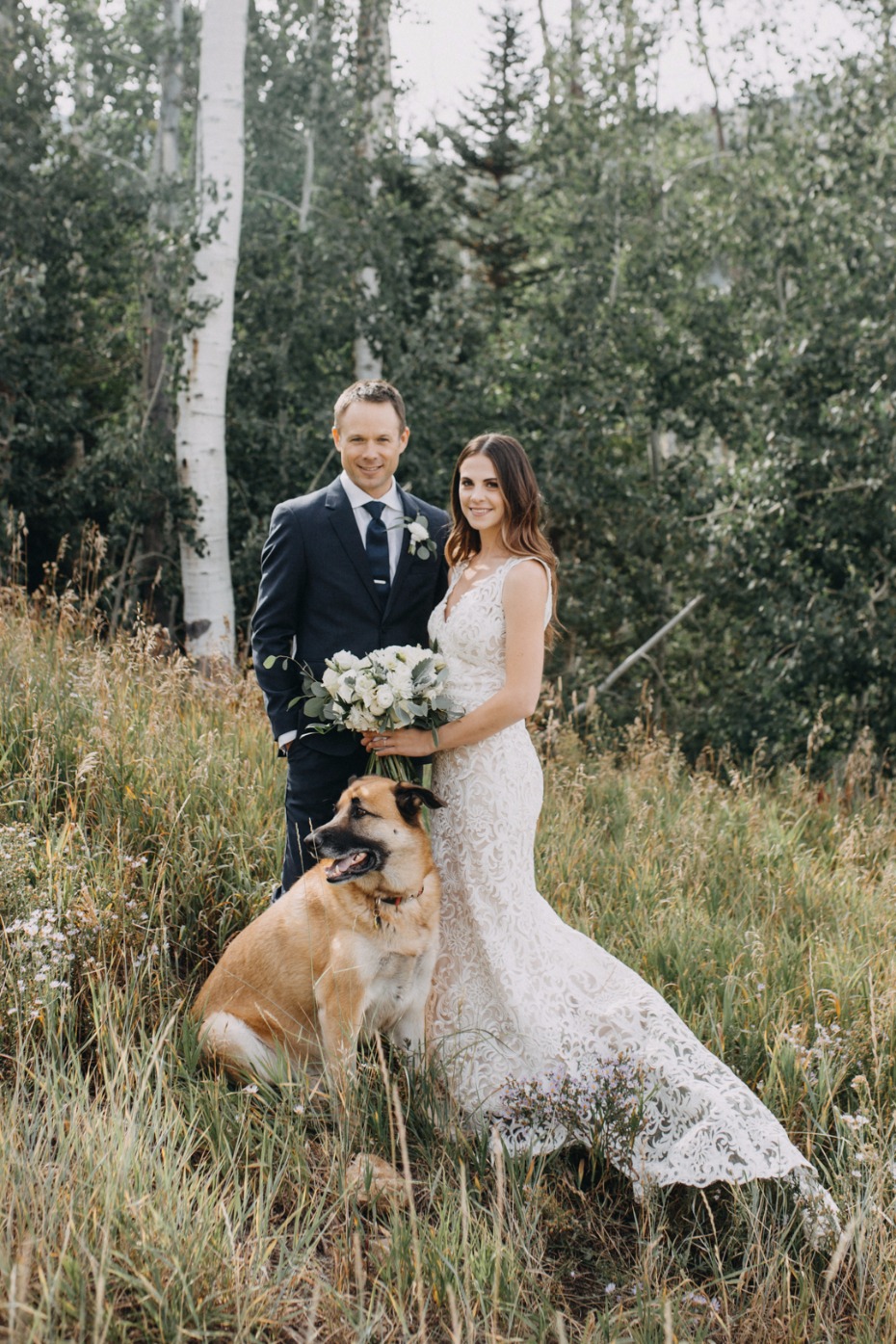 rustic mountain top wedding couple with their dog