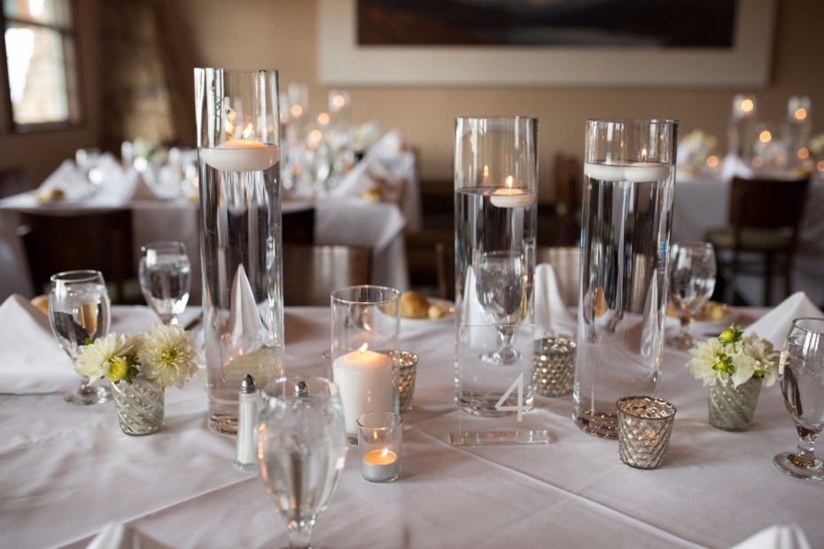 all white and wedding table centerpiece and floating candles