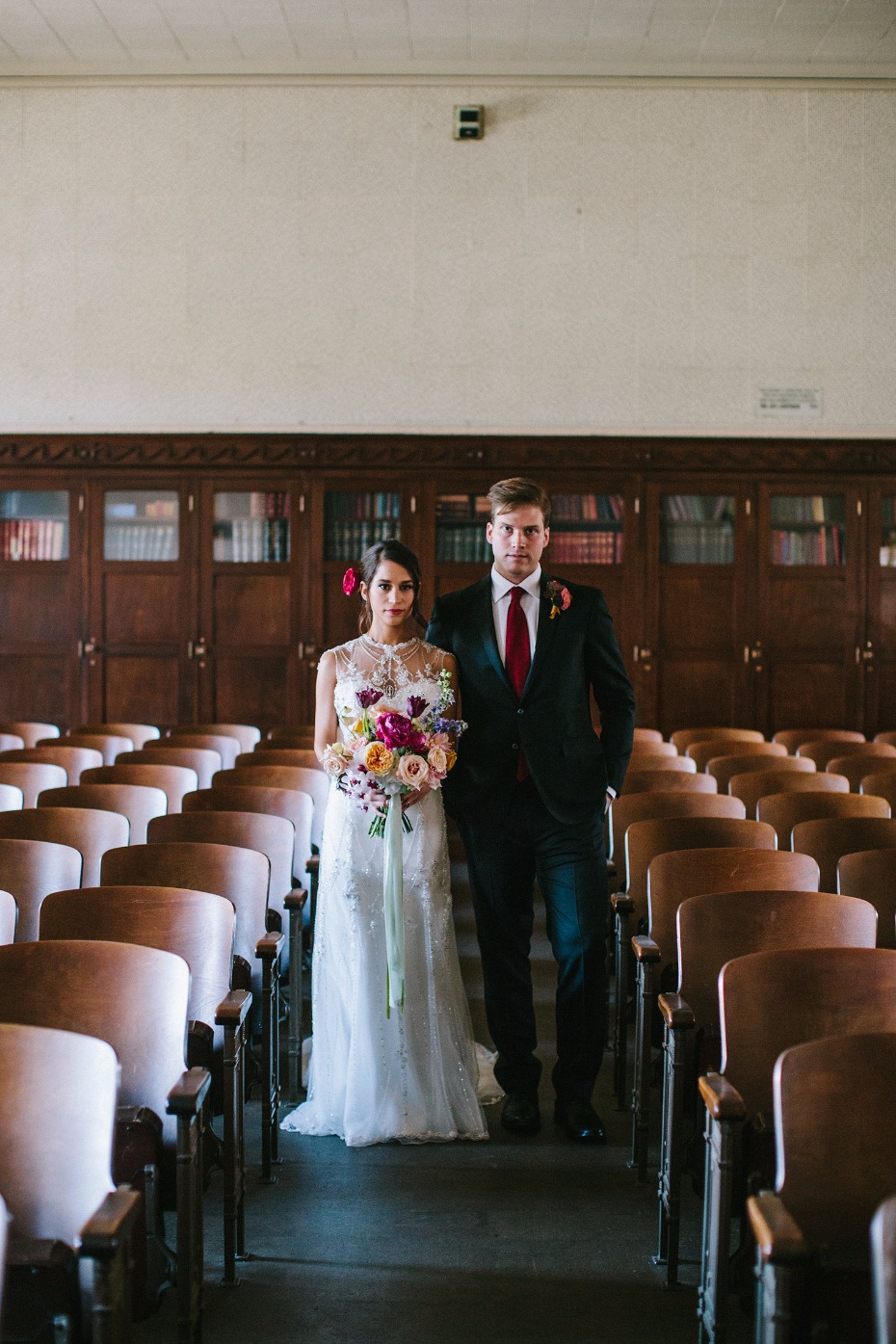 Bride and groom wedding in vintage auditorium setting