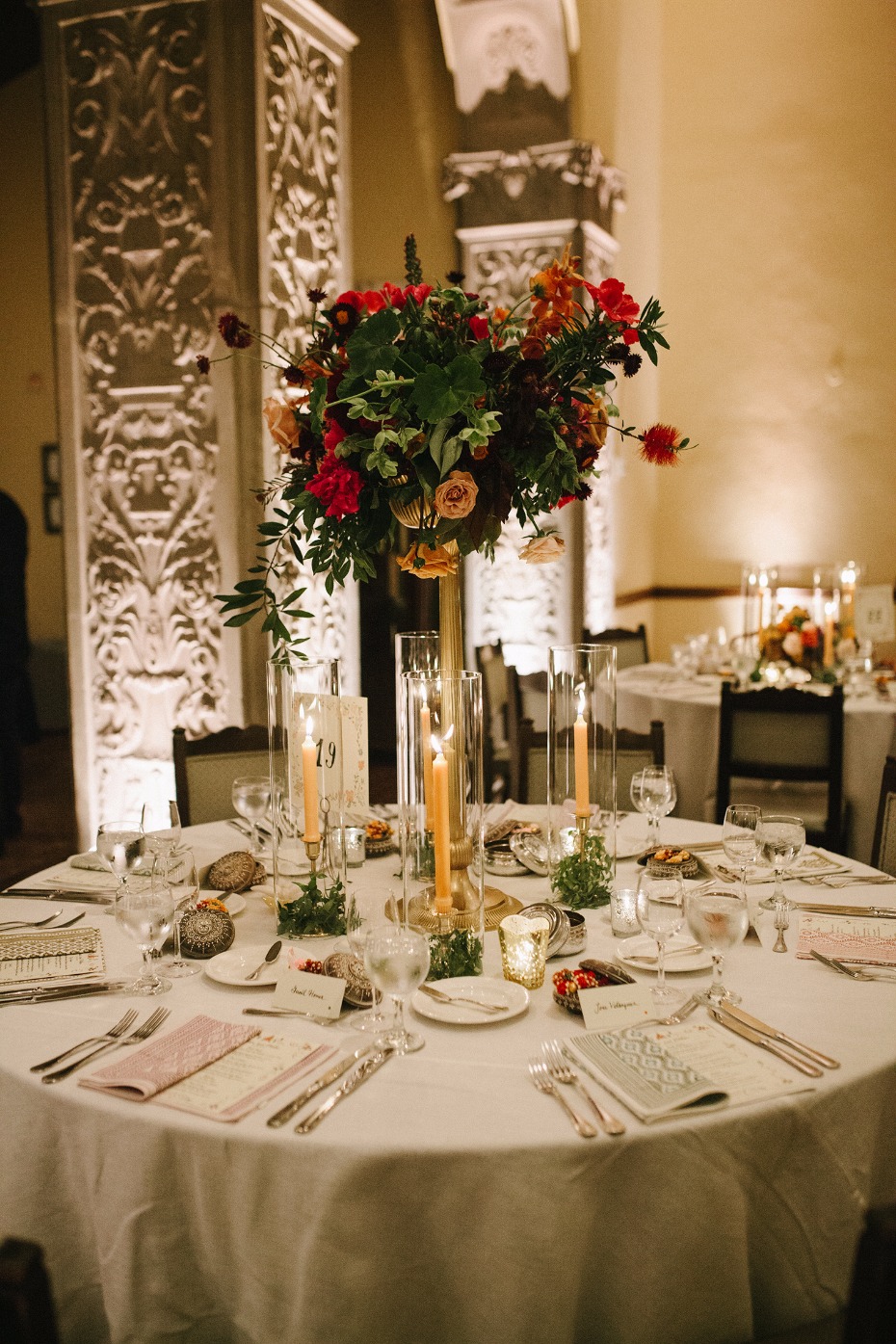 Tall floral centerpiece with candles