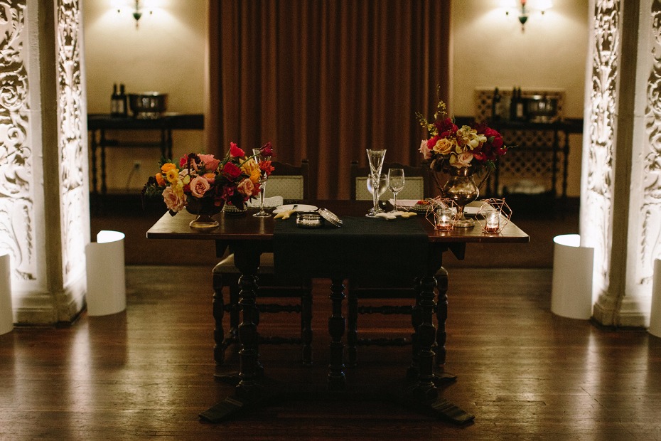 Romantic dinner table setting with flowers candles