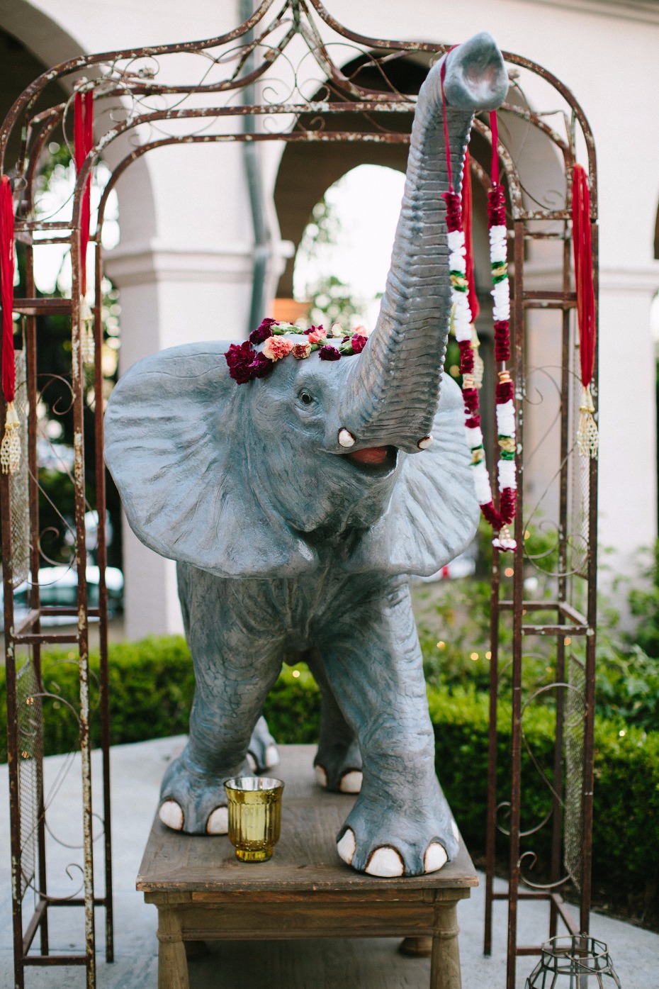 Elephant statue with raised trunk and floral decorations