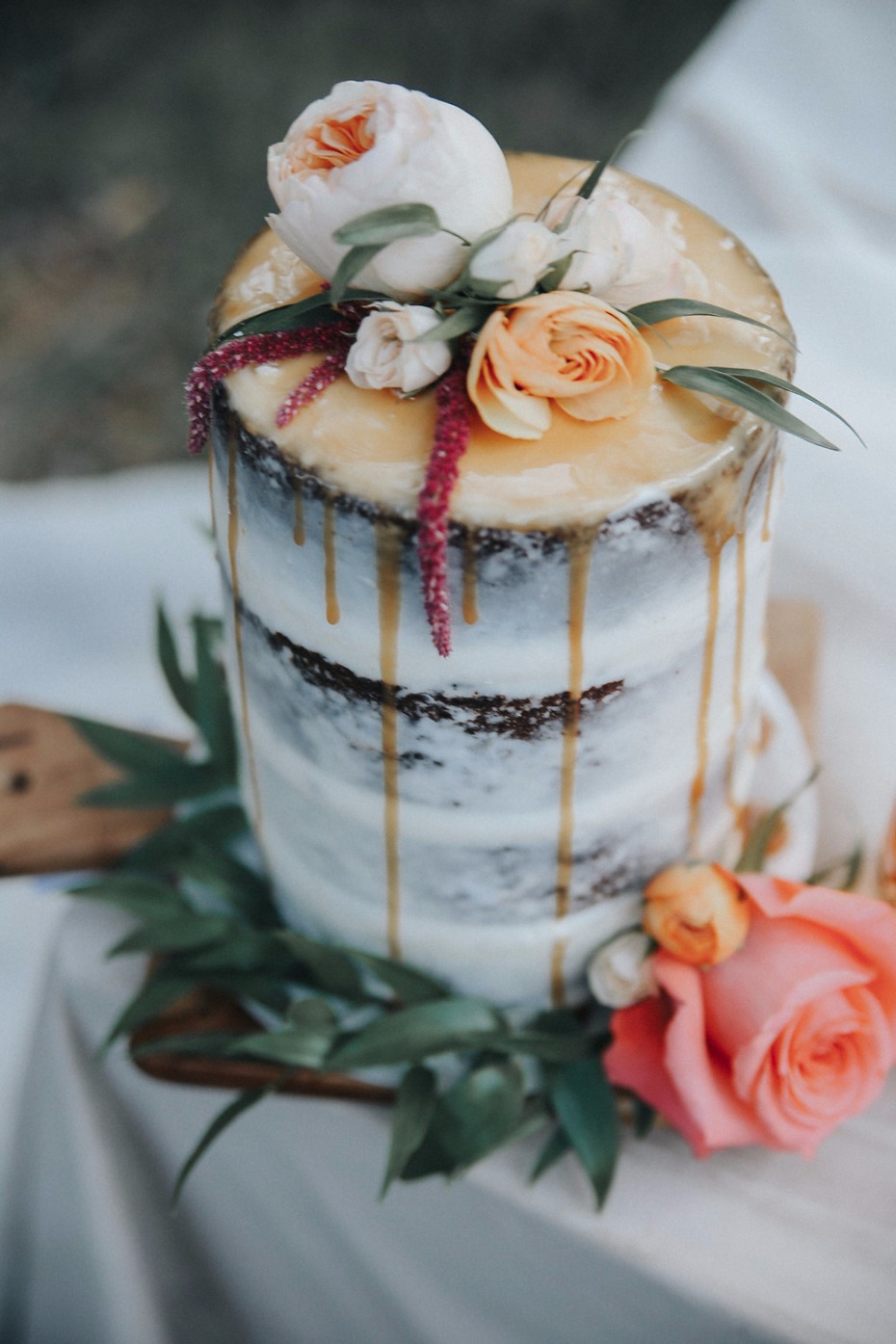 nearly naked wedding cake with caramel drizzle