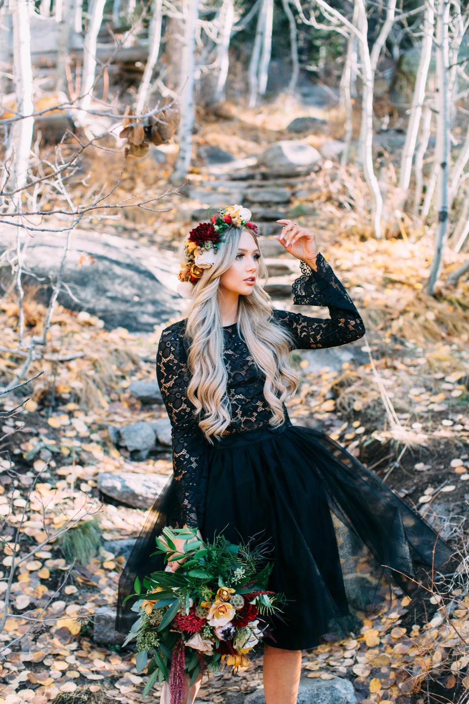 Blonde woman flower crown black dress autumn forest