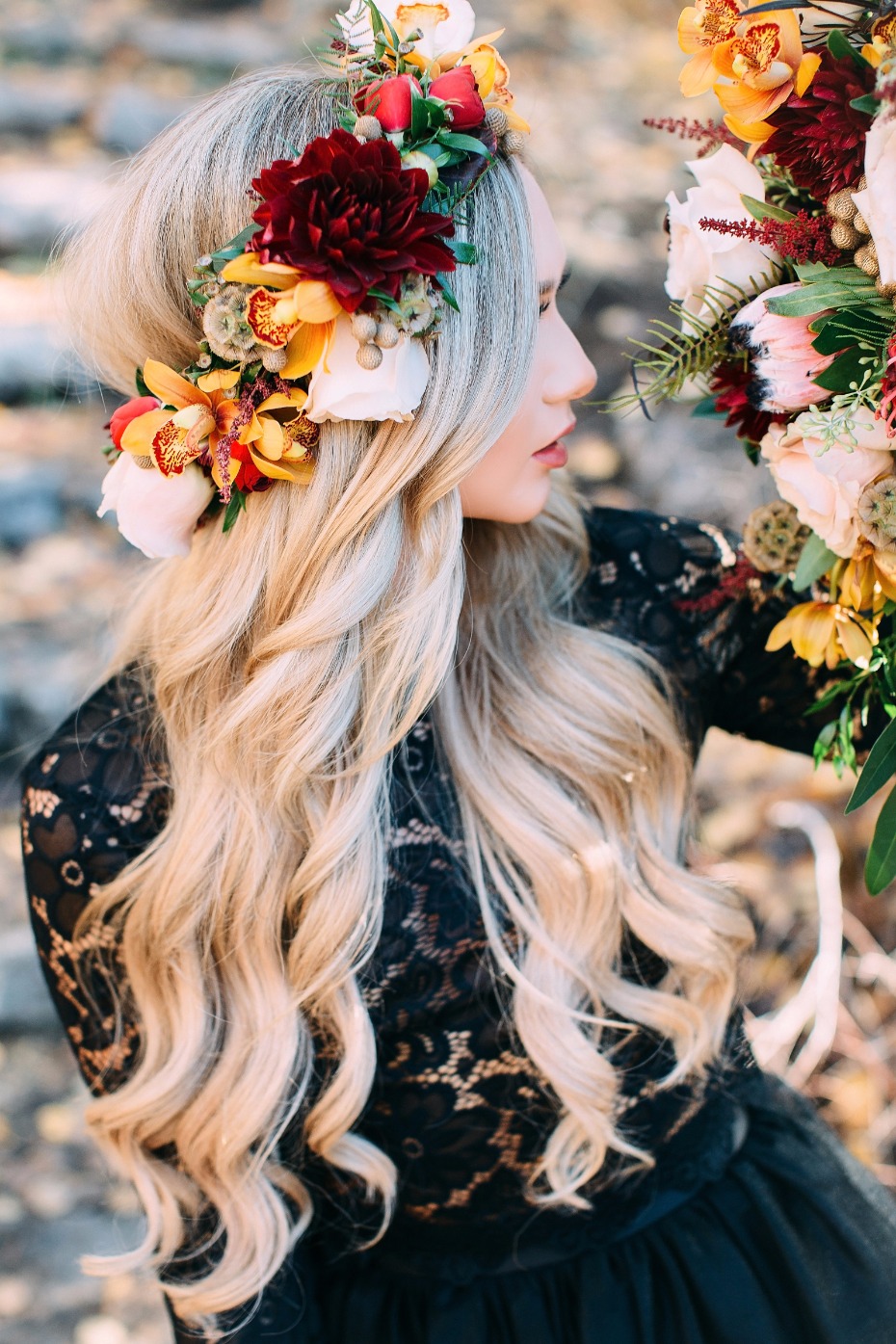 Blond woman in black lace dress with autumn flower crown