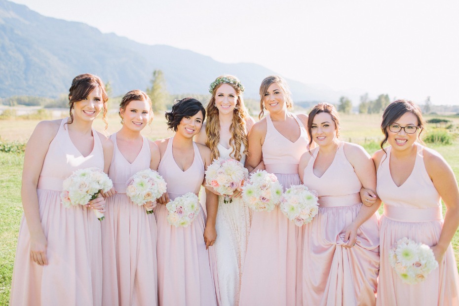 Blush bridesmaid dresses and white bouquets