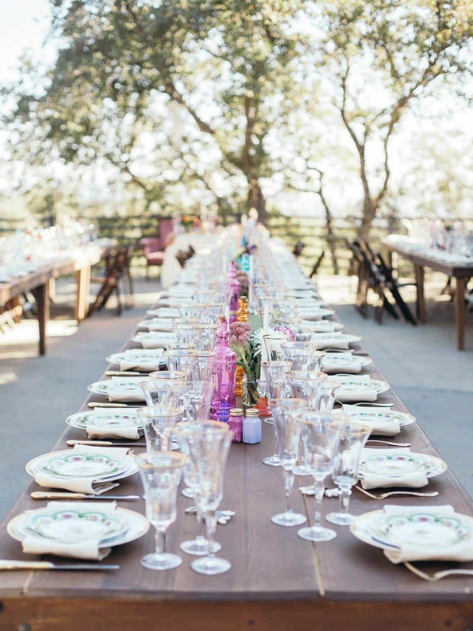 fun family style wedding tables with boho shabby chic style place settings
