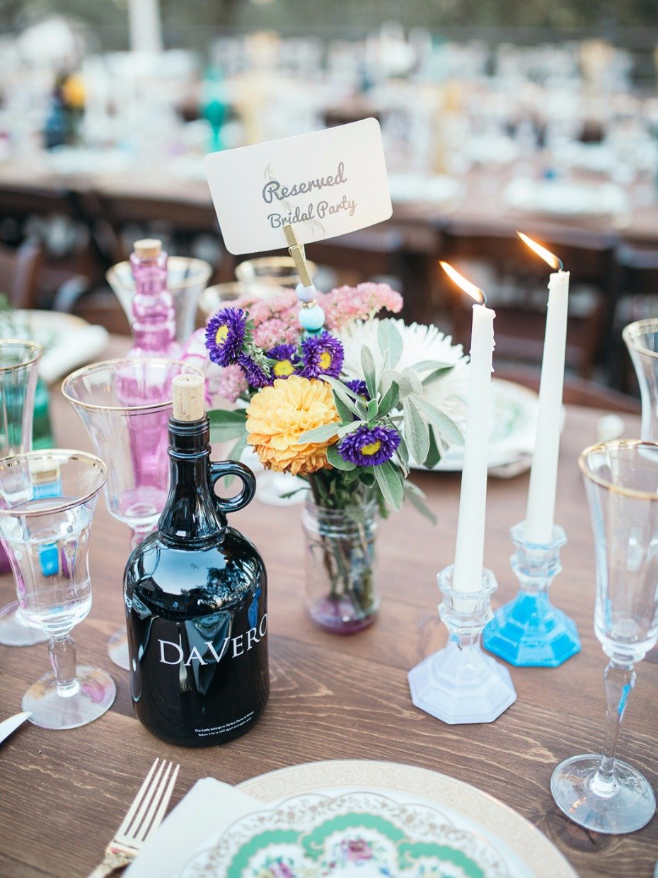 bride and grooms favorite wine mixed with mismatched table accessories
