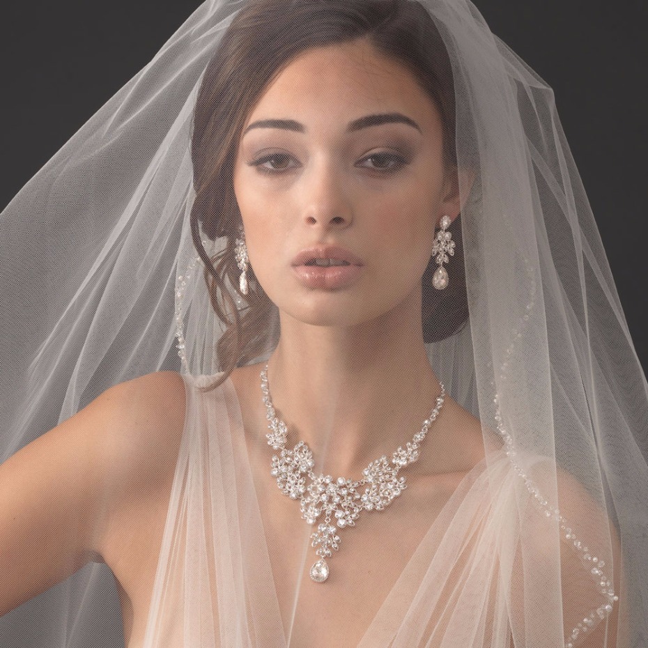 Beautiful bride with sparkling wedding jewelry set