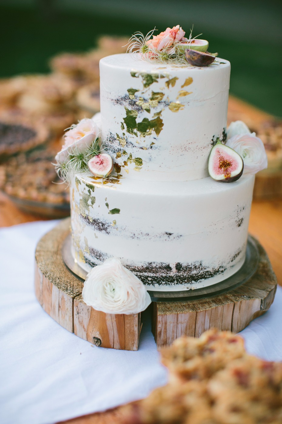 Naked cake with gold foil and figs