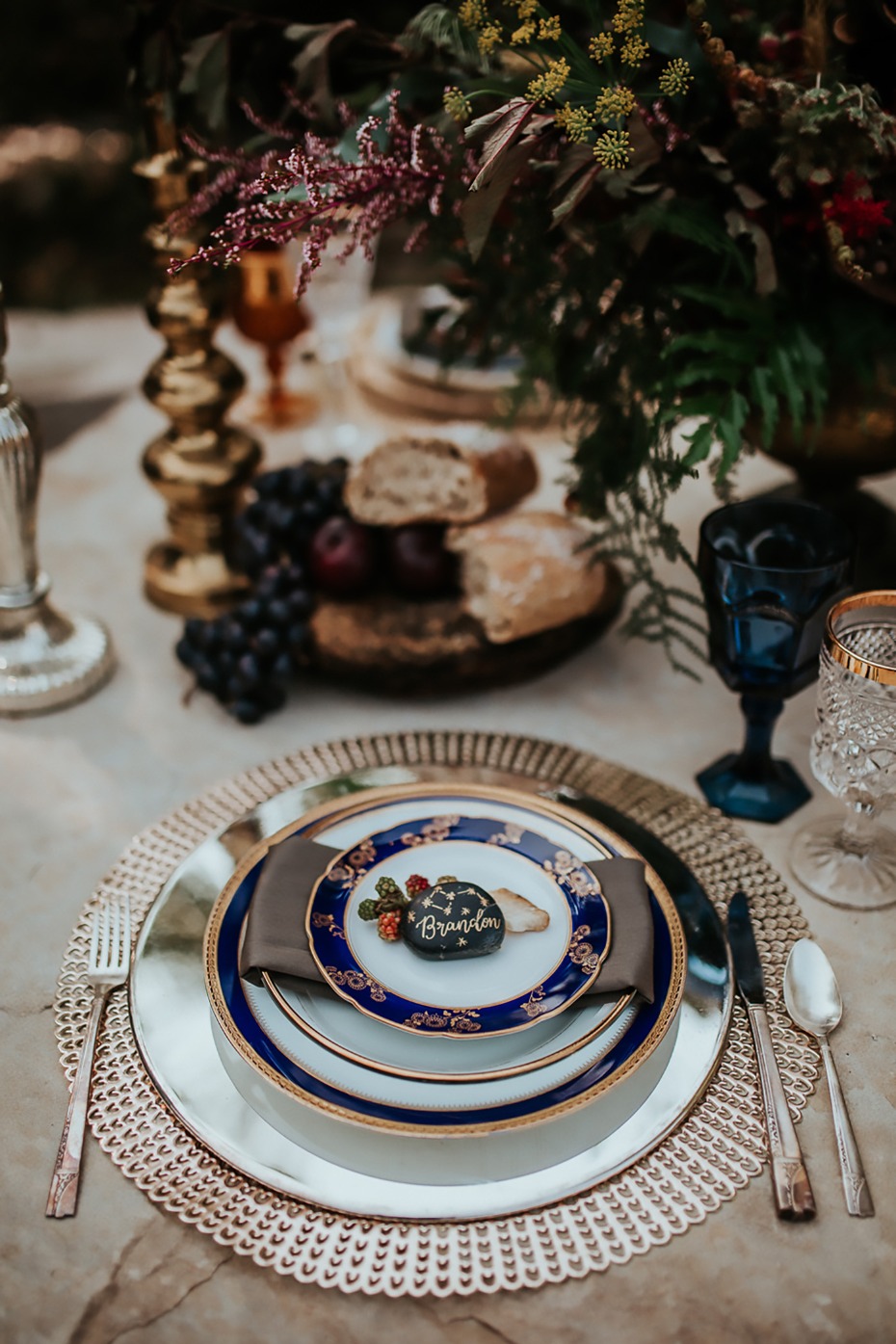 silver gold and blue wedding place setting