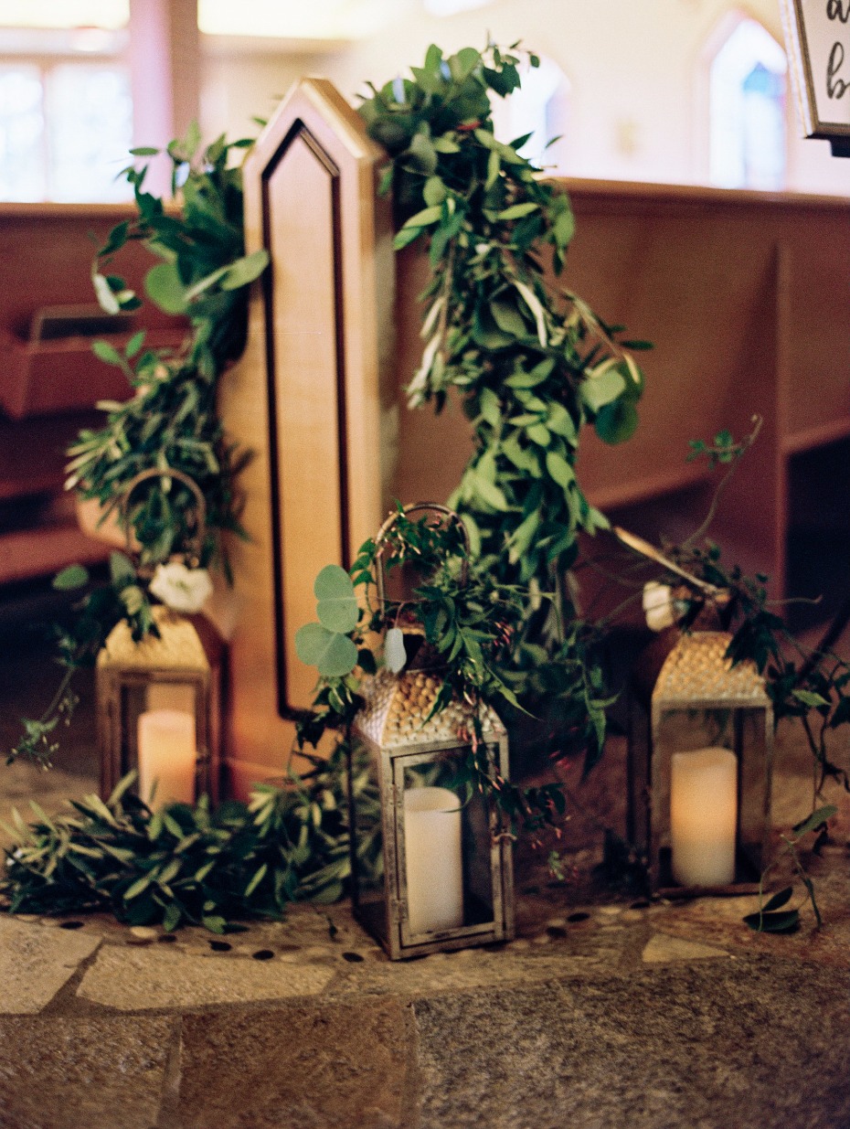 Lantern and greenery ceremony decor