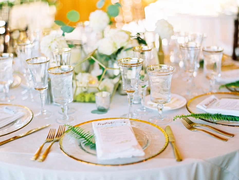 Gold and white table with greenery