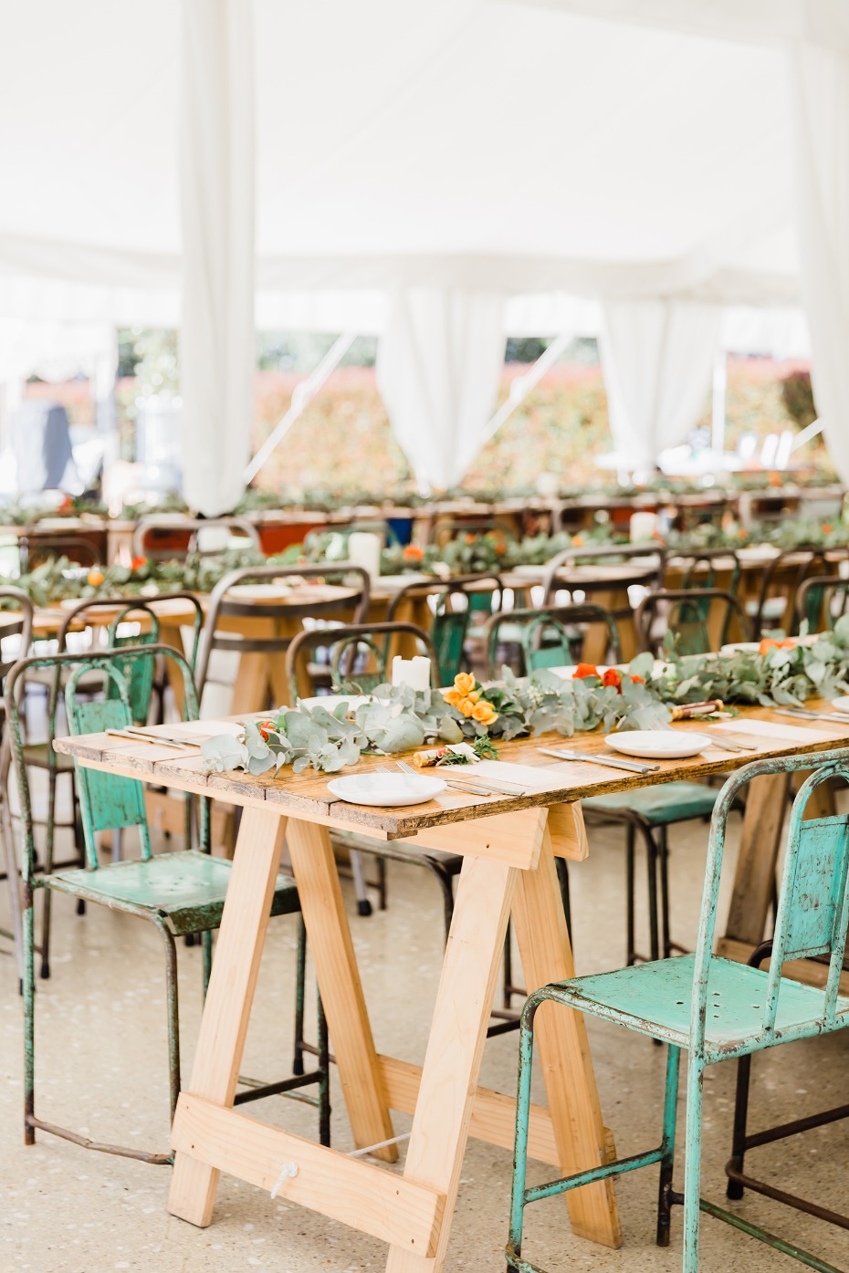 mismatched wedding seating for your tented wedding reception