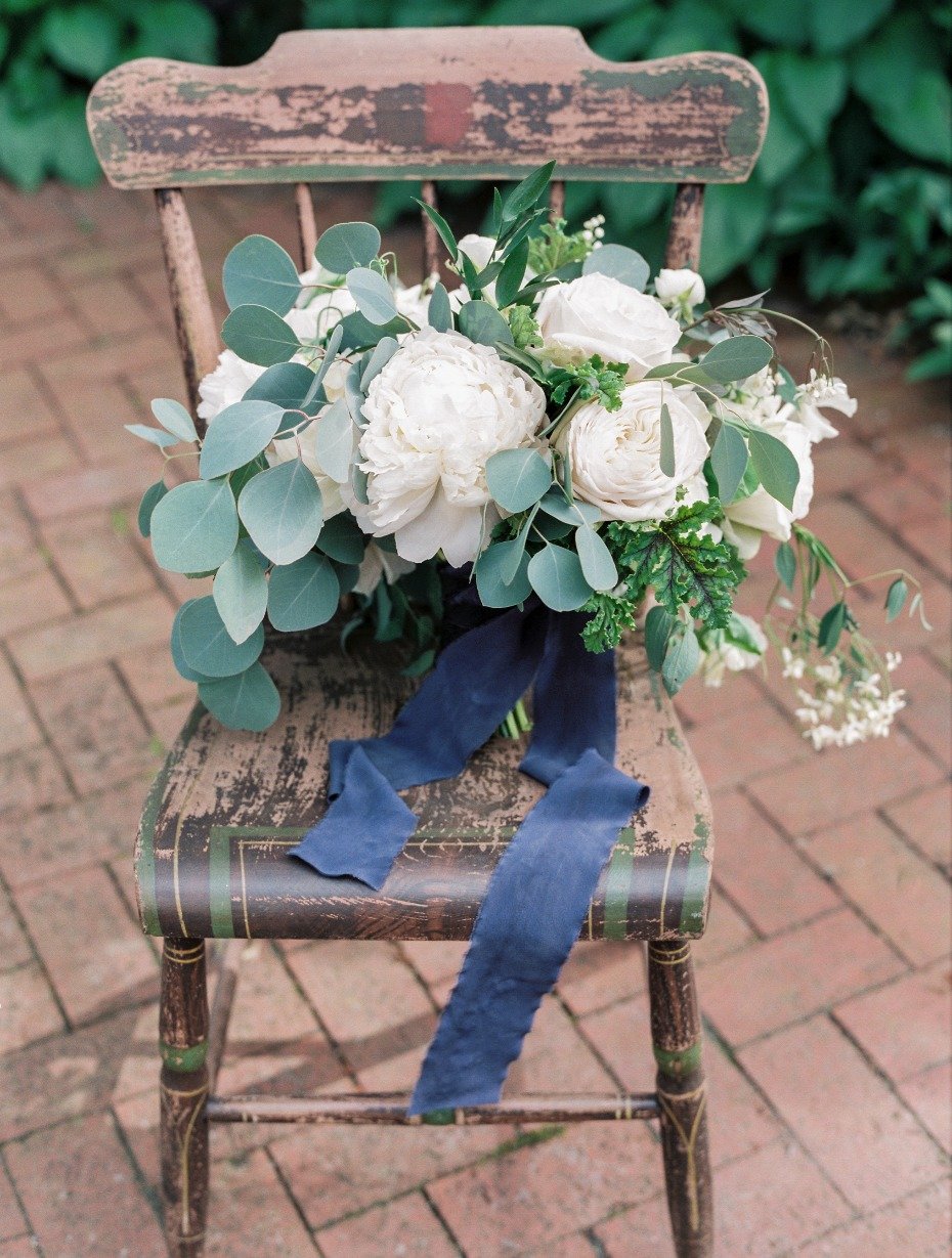 romantic white bouquet with cascading greenery