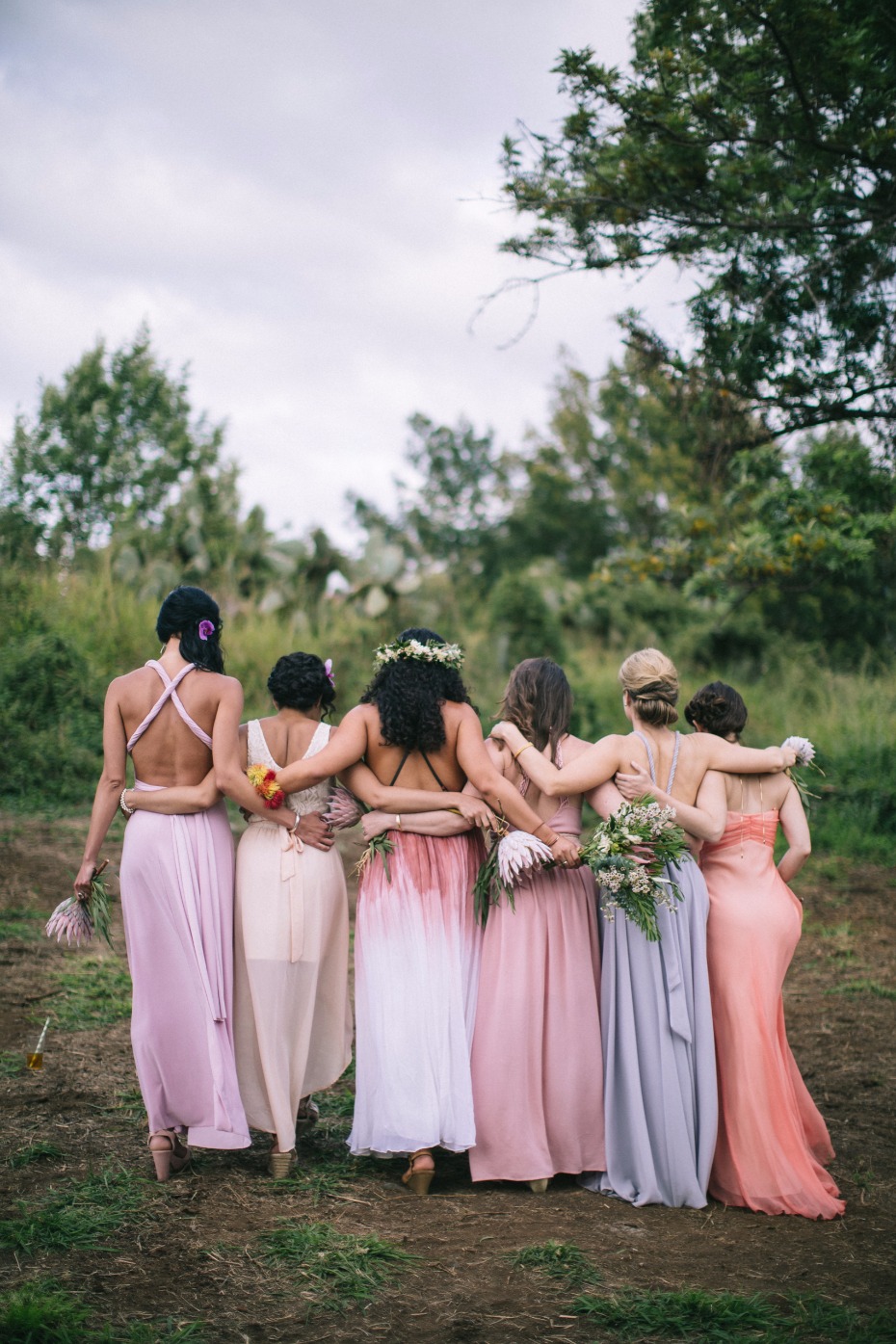 bridal party in mix and matched pastel dresses