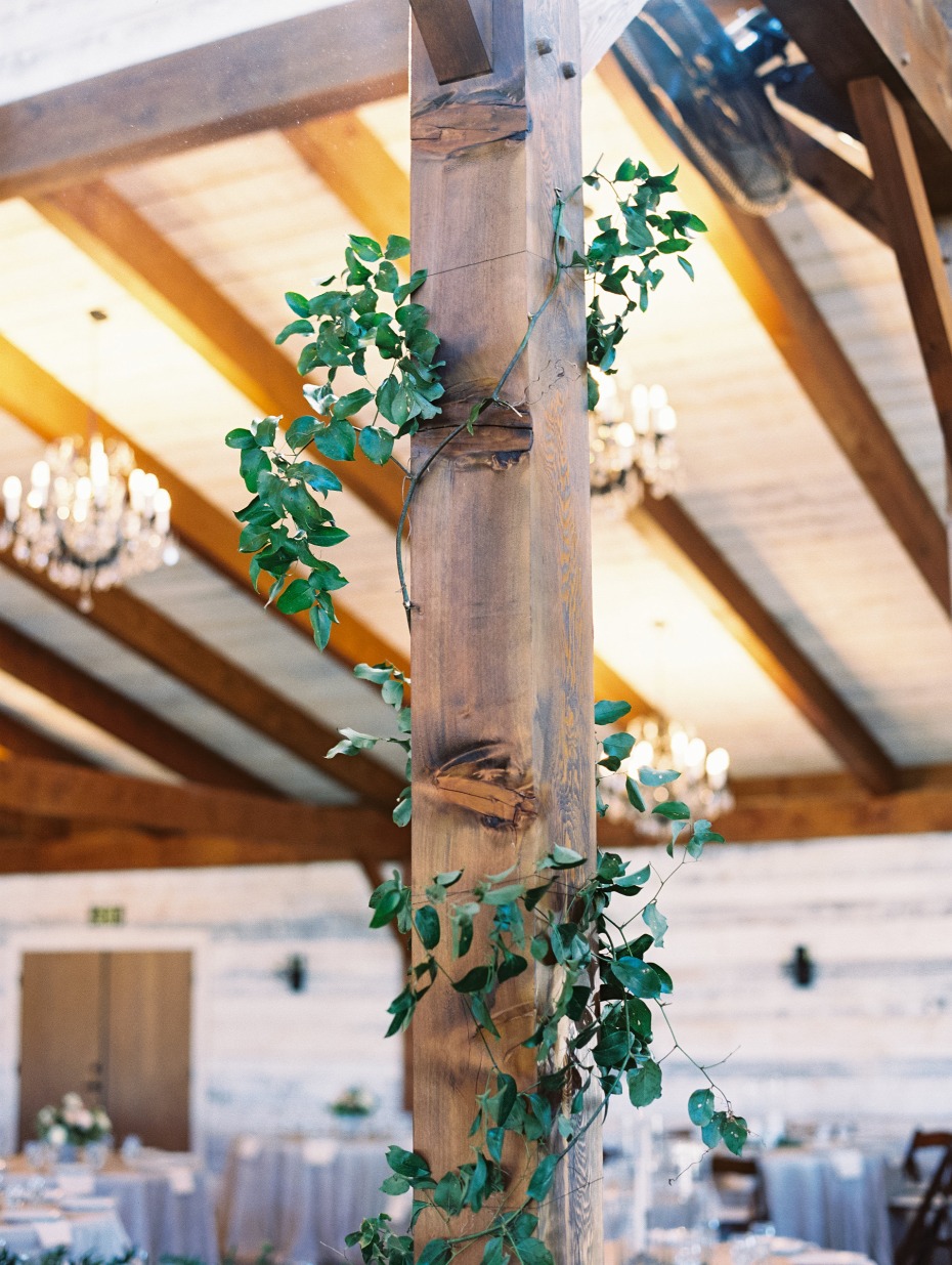 wrapping the rustic beams of the venue in ivy