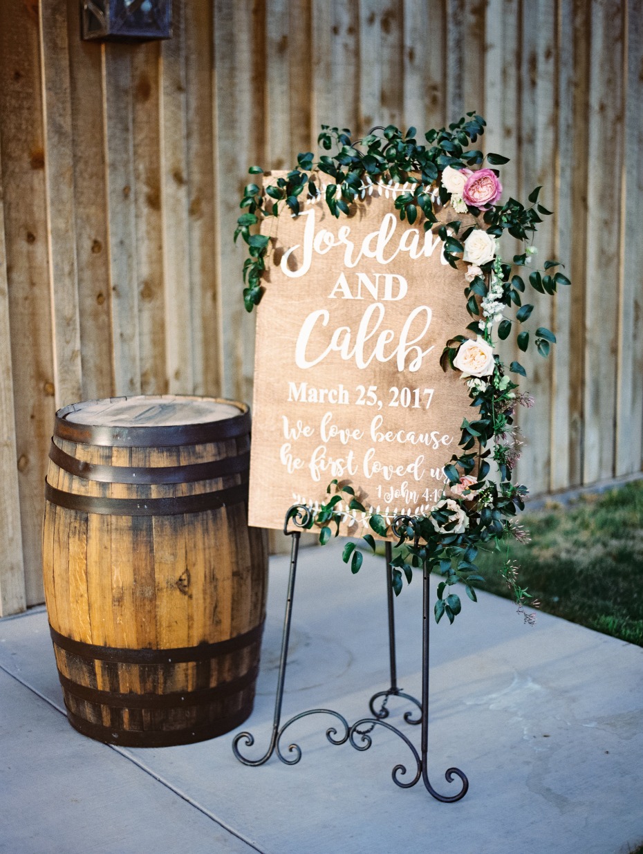 romantic floral draped wedding sign