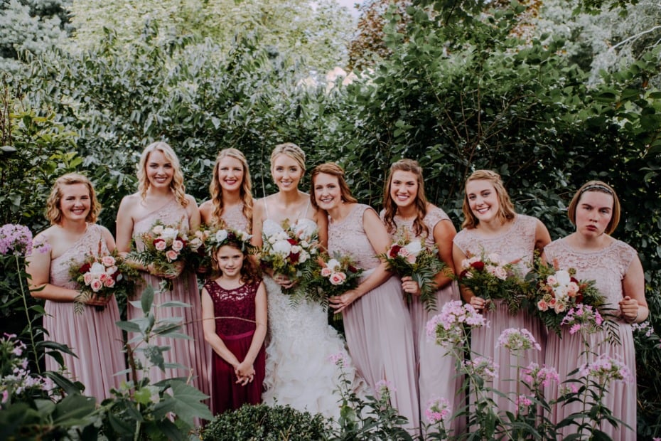 bridemaids in soft pink dresses